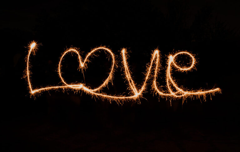 "Love" written with a sparkler firework.