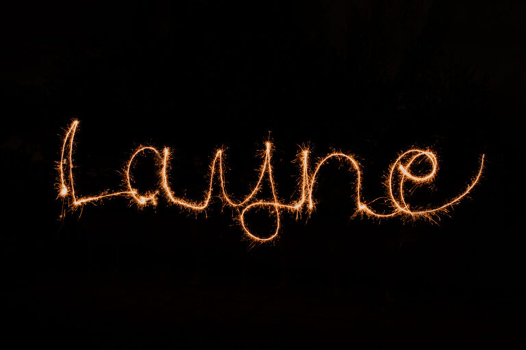 The name Layne written with a sparkler. Learn to write with sparklers & photograph it!  