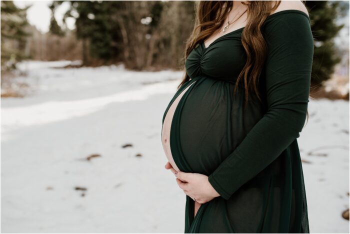 SNOWBASIN MATERNITY PHOTOGRAPHY TYMBER JOSH20 700x468 - Baby Bump Close-Up | Snowy Maternity Session