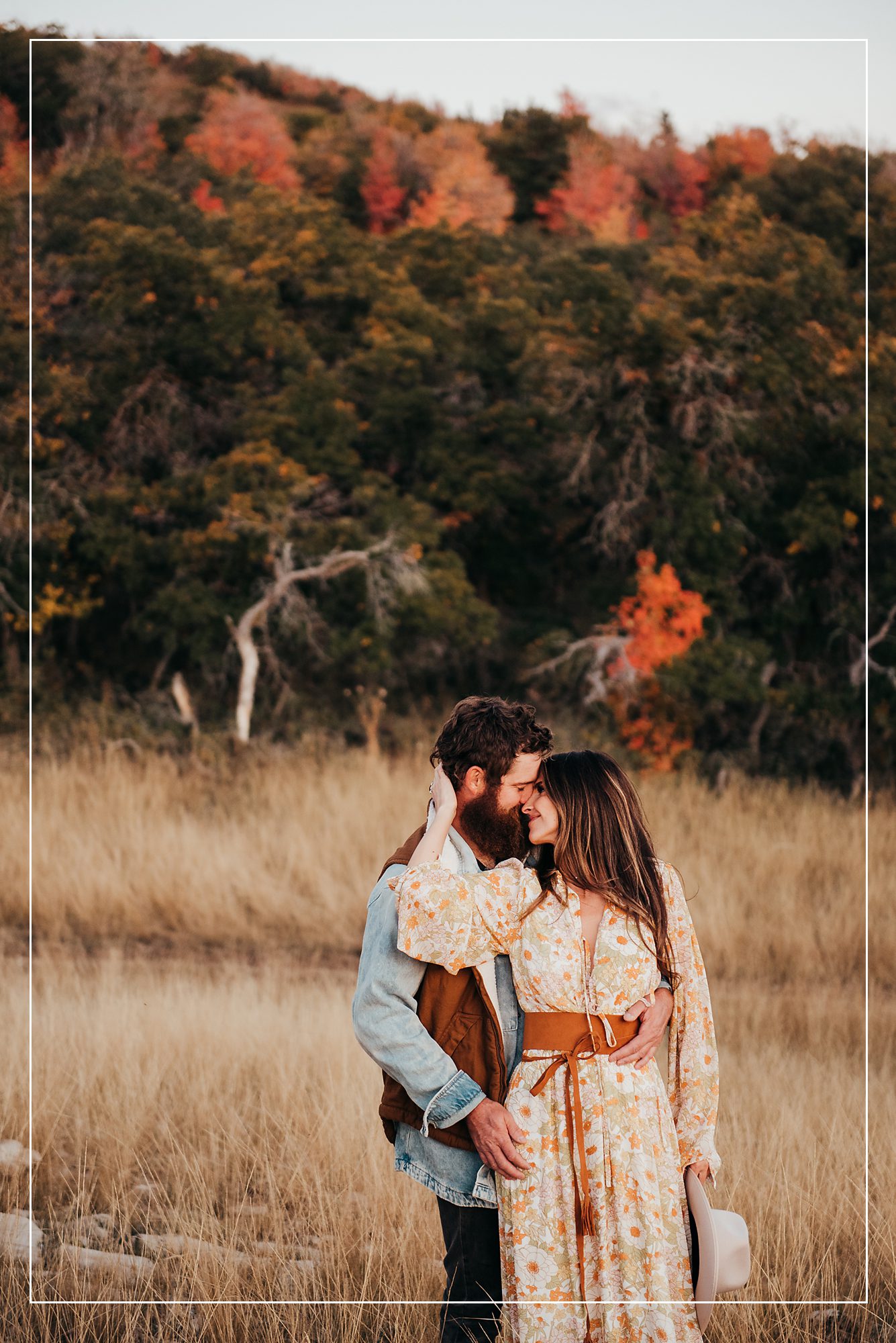 Couple sharing a tender moment during a romantic photo session in Utah, captured with the beauty of golden hour lighting